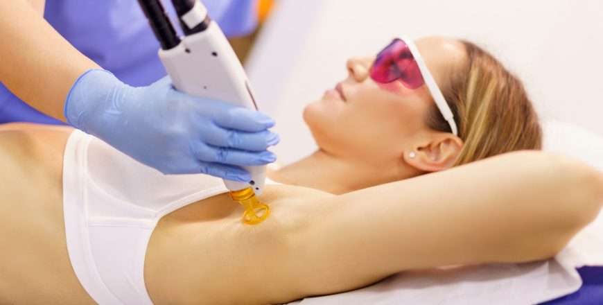 woman-receiving-underarm-laser-hair-removal-at-a-beauty-center.jpg